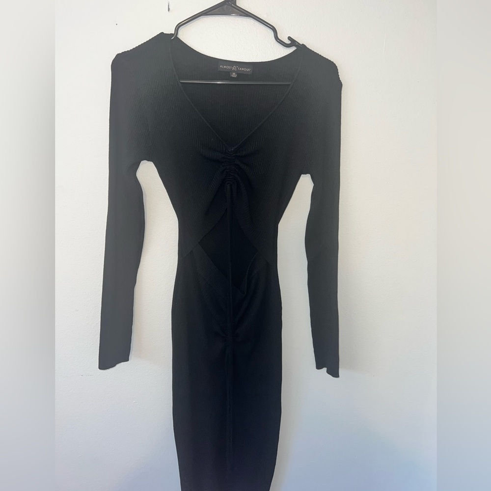 Long sleeve black dress with cut in middle